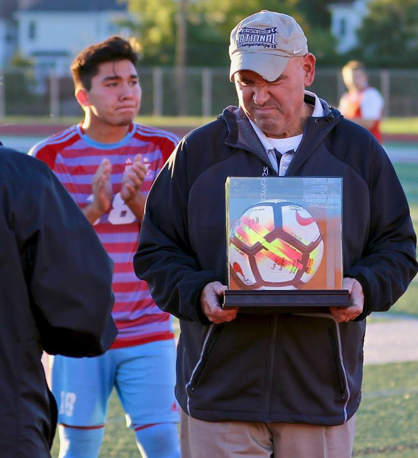 While+being+presented+an+award+for+coaching+11+years+on+senior+night%2C+varsity+head+coach+Michael+Skordos+and+senior+Harry+Skordos+cry+for+their+last+home+game.+M.+Skordos+has+coached+his+son%2C+H.+Skordos%2C+since+he+was+young.+%E2%80%9CIts+really+rewarding+that+my+dad+has+been+able+to+coach+me+for+so+long.+The+fact+that+he+waited+until+I+graduated+to+retire+means+a+lot%2C+especially+that+we+could+spend+our+last+home+game+together%2C%E2%80%9D+H.+Skordos+said.+