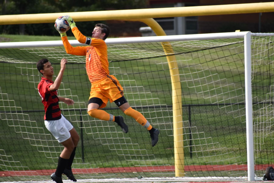 Leaping to save a ball, senior Nolan Cosgrove defends the goal against an opposing shot from Parkway Central. After deciding to attend University of Tulsa, Cosgrove is looking forward to the competitive nature of college soccer. “Playing soccer in high school is just trying to play at the highest level that you can while you’re here and trying to put in as much work as you can while you’re here, so that way you can be prepared whenever you do go into that college environment,” Nolan said. 