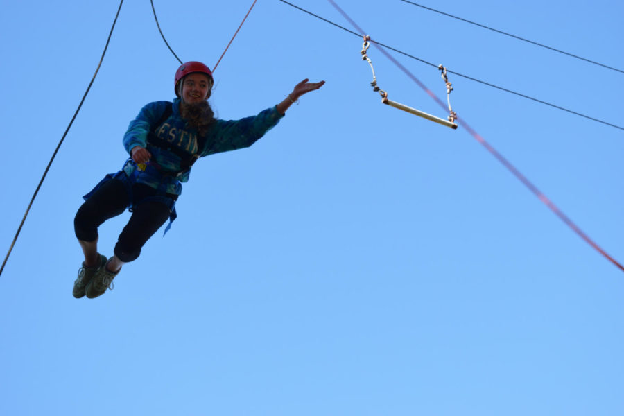 Soaring+through+the+air%2C+sophomore+Sarenna+Wood+takes+on+the+Parkway+North+ropes+course%2C+part+of+the+Adventure+Pursuit+field+trip+Oct.+29.+The+students+jumped+off+tall+platforms+and+attempted+to+grab+trapeze+bars.+%E2%80%9CIt+was+terrifying+actually%2C+getting+on+top+of+it+was+the+hardest+part%2C+it+was+all+adrenaline+and+you+didnt+feel+anything+else%2C%E2%80%9D+Wood+said.