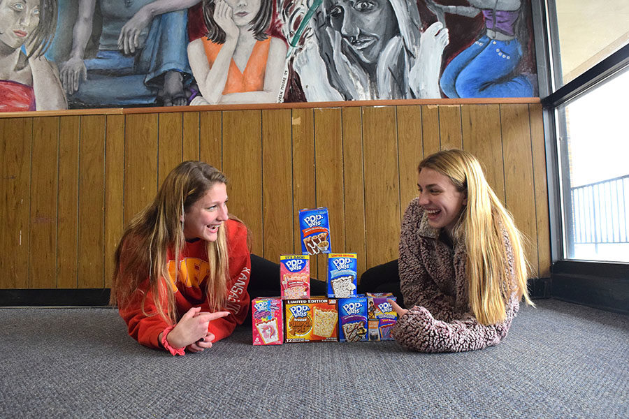 Sophomores Irene Yannakakis and Anna Pavlisin lay in the hallway deciding what Pop Tart flavor to try next. 