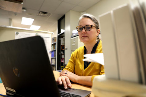 Inside the English Concepts Center, teaching assistant Rose Rouner works on her laptop. Rouner spends most of her mornings answering emails for parents of students in the Eighth Grade Acceleration program. A lot of it is getting information to the parents or just answering questions,” Rouner said. “Some of it has to do with communication between teachers and parents, like about registration for the following year or having an information meeting coming up. 