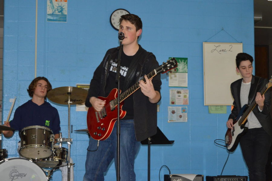 Strumming his guitar and singing into the microphone, junior Ryan Egan performs with his band The Brink STL at last year’s benefit concert. Egan has been playing concerts in the St. Louis area for four years. “I love performing,” Egan said. “It’s a lot of fun. I enjoy playing in front of a crowd and just playing music in general. I hope to release some music so that I can spread my messages of positivity, perseverance and dedication.”