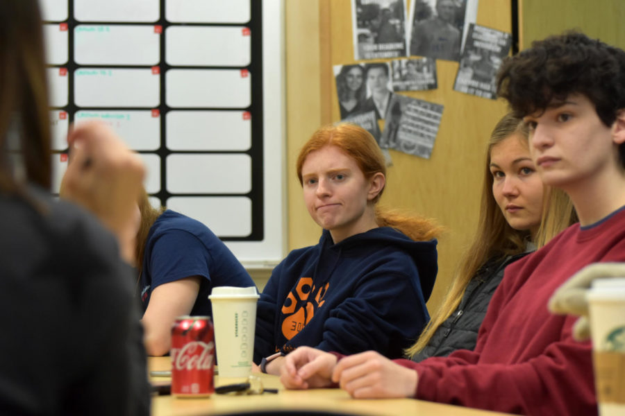 Pathfinder editors sit in the journalism classroom before school recapping that week. 