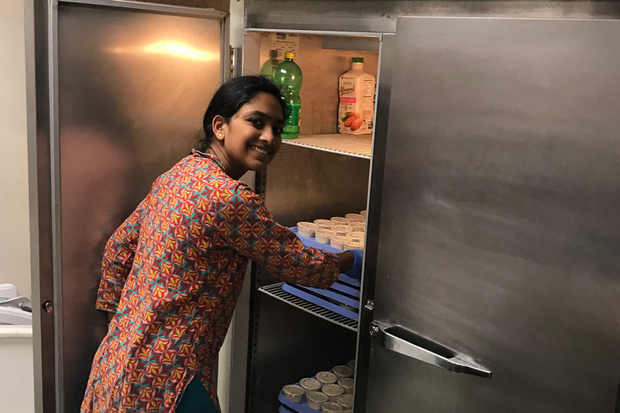 Stacking condiments in the Hindu Temple of Saint Louis kitchen, freshman Brinda Ambal volunteers while also gaining a better understanding of her culture and religion. Ambal has been a member of her temples Youth Group since 2016. “In St. Louis I can make [Hinduism] my own. The small things arent that important, its about how you live your life and follow the religion as a whole,” Ambal said. “A lot of our Holy Texts have stories about courage and trusting yourself so that you are best able to serve others.” 