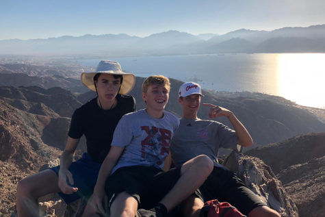 Smiling with friends, sophomore Joe Rosenberg participates in a 5-day hike across the Northern part of Israel. Rosenberg, alongside other students in the Heller High program, slept outside and self-navigated for the entire duration of their journey. “On the last day, I happened to flip over my bike and gash my hands so I got to ride in a medic car all the way to the Mediterranean Sea,” Rosenberg said. 