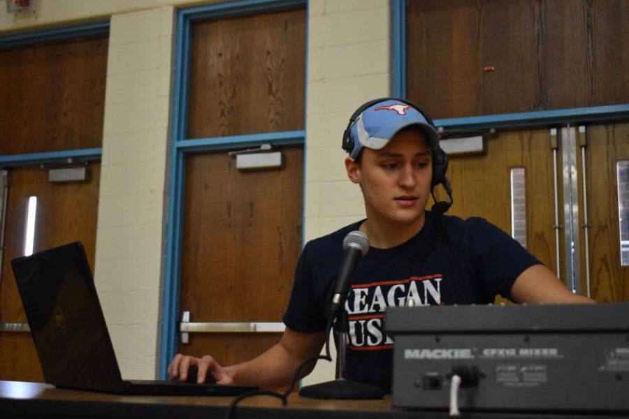 Sitting at the microphone, senior Zaven Nalbandian announces the basketball game. LSP streams every home basketball game through YouTube’s live streaming service. “It can get complicated at times with all the high-tech equipment but after I really got the systems down I can focus on providing good commentary,” Nalbandian said.