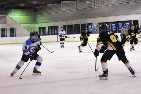 Sophomore Ty Waddell takes stride into the offensive zone looking to add to their lead against the Lafayette Lancers. The Longhorns lead the game 3-1 in the third period. “I was just trying to get through the defender and get a good scoring chance and put the puck on net,” Waddell said.