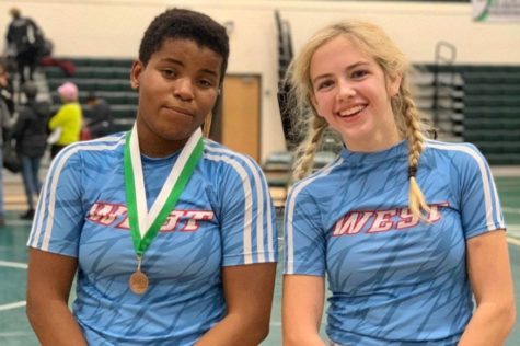 Sophomore Emma Carter and freshman Paige Wehrmeister pose together after the Mehlville Women’s Invitational Dec. 21. The tournament was the first girls tournament that either one had been to; Carter took third place in the 167 pound weight class, and Wehrmeister took fifth in the 121 pound weight class.