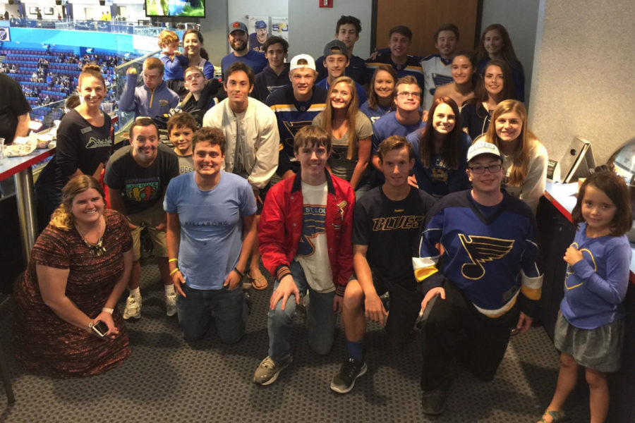 Kelly+Quinn%2C+standing+to+the+left%2C+poses+with+Best+Buddies+at+a+Pre-Season+St.+Louis+Blues+game+hosted+by+St.+Louis+Blues+Alumni.+This+opportunity+helped+members+of+Best+Buddies+strengthen+their+friendships+through+a+shared+passion+for+hockey.+%E2%80%9C%5BI+love%5D+witnessing+two+people+click+as+friends%2C%E2%80%9D+Quinn+said.+%E2%80%9CIt+is+like+watching+magic+or+seeing+someone+truly+come+to+life.+The+joy+from+seeing+others+feel+joy+is+extremely+powerful.%E2%80%9D