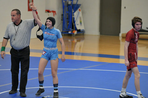 Hand raised after her first pin of a male opponent, Wehrmeister grins at her triumph. “I feel like I am in control of them [when I’m on top], and if I wanted to I could control everything that was happening in that moment,” Wehrmeister said. “They can’t get up if I don’t let go.”