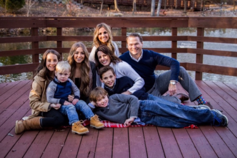 The Morgan-Hopkins family sits together for a group photo. The family of eight lost their home to a house fire Feb. 2.  "This makes you realize the little things in life that you don’t even realize you are blessed with, as simple as a toothbrush, a change of clothes, toiletries, food or personal and memorable belongings. Always appreciate what you have been given," alumna Madison Hopkins said. 