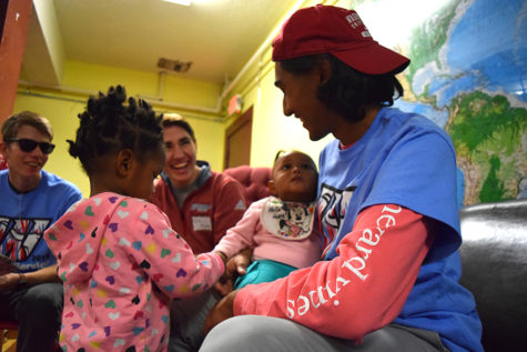 Senior Farhan Hassan entertains children while volunteering at the Gateway 180 shelter for day of service. Last year students got to read books, played with the kids and sorted out the donation closet. “Volunteering at Gateway 180 allowed students to not only see the other side of St. Louis, but also it helped those impoverished families to the best of our ability,” Hassan said. “Even if it was only one day out of the year, I’m sure we made a huge impact on some of the people staying there.”
