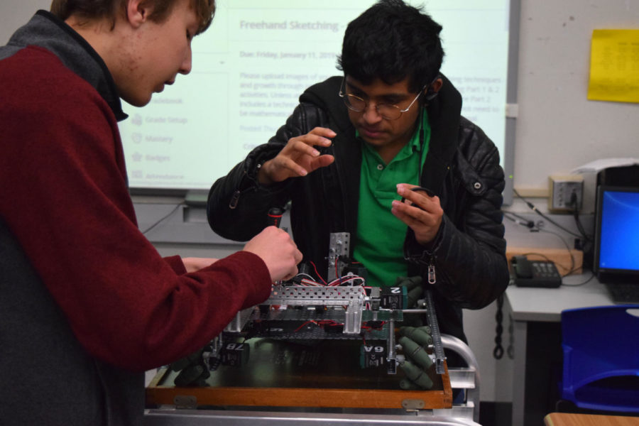 Attending+a+meeting+after+school%2C+sophomore+Kunal+Addagarla+makes+adjustments+to+their+robot.+Twisted+Metal+was+not+able+to+qualify+for+the+2019+Missouri+State+VEX+Championship%2C+but+they+will+be+newcomers+at+the+CREATE+US+Open+Robotics+Championship+displaying+teams+from+across+the+U.S.+and+China.+%E2%80%9CI+would+say+teamwork+is+very+important+because+we+have+different+roles+to+fulfill%2C+Addagarla+said.+Im+one+of+the+programmers+for+my+team+and+I+want+to+make+sure+that+my+code+works+%5Bso+I+have+to%5D+test+the+robot+occasionally.+%5BThen%5D+the+rest+of+my+team+is+building+or+researching+various+ways+we+can+build+a+better+robot.+