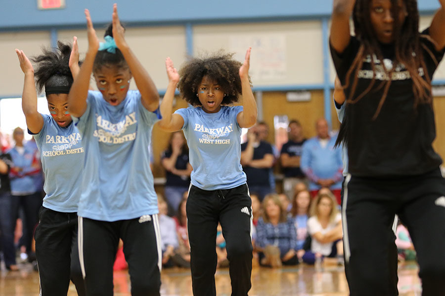 The Parkway Step Team performs during the homecoming pep rally Sept. 28. The team plans to travel to Virginia Beach, VA to perform this weekend for a national competition. “Performing in front of the school is way different than a real competition because there are not as many people watching you at school and its less pressure because its not a competition, its just a chance to have fun. But at a real competition, there is a lot more pressure to win, and there are more than 2,000 people watching you, usually,” sophomore RoNeeka Boyd said.