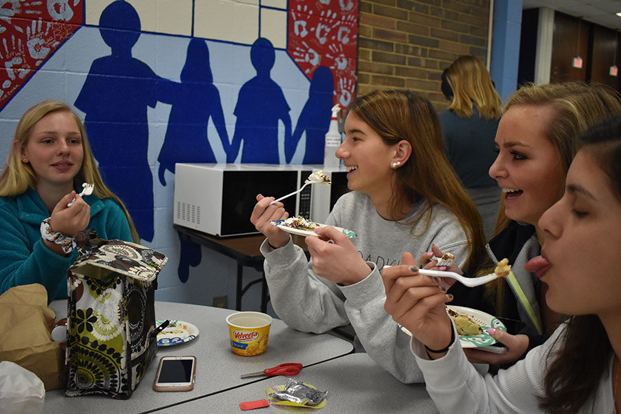 On Pi Day, March 14, juniors Emily Weaver, Emily Lofgren, Lauren Adam and Katie Mendonsa support Mu Alpha Theta’s Pi day fundraiser by purchasing and eating slices of “Pi”. Mu Alpha Theta sold 109 pies for $2 per slice, the proceeds will go toward the math department for new desks, subsidizing math contest fees and new calculators. “Eating pie is a fun way for kids to get involved with math activities that they normally couldnt participate in on other days,” Lofgren said. 