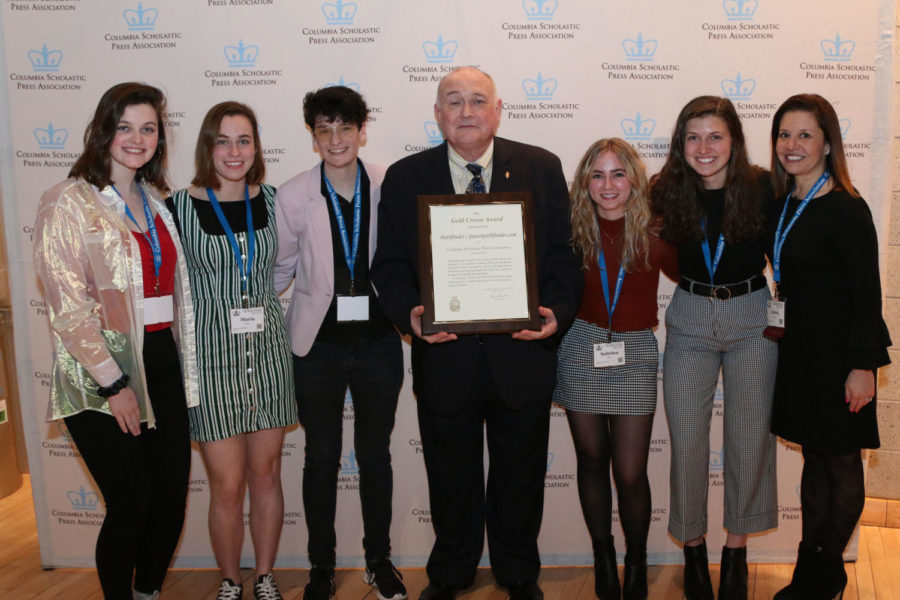 Pathfinder editors junior Lydia Roseman, seniors Maria Newton and Dani Fischer and juniors Sabrina Bohn and Emma Caplinger, along with Journalism Adviser Debra Klevens take a photo with Edmund J. Sullivan, the Executive Director of the Columbia Scholastic Press Association, after receiving a Gold Crown award. In 2018, the Pathfinder won a CSPA Silver Crown Award. “It was an incredible experience to be in a room with so many of the schools that we look up to and draw inspiration from,” senior and Managing Editor-in-Chief Dani Fischer said. 