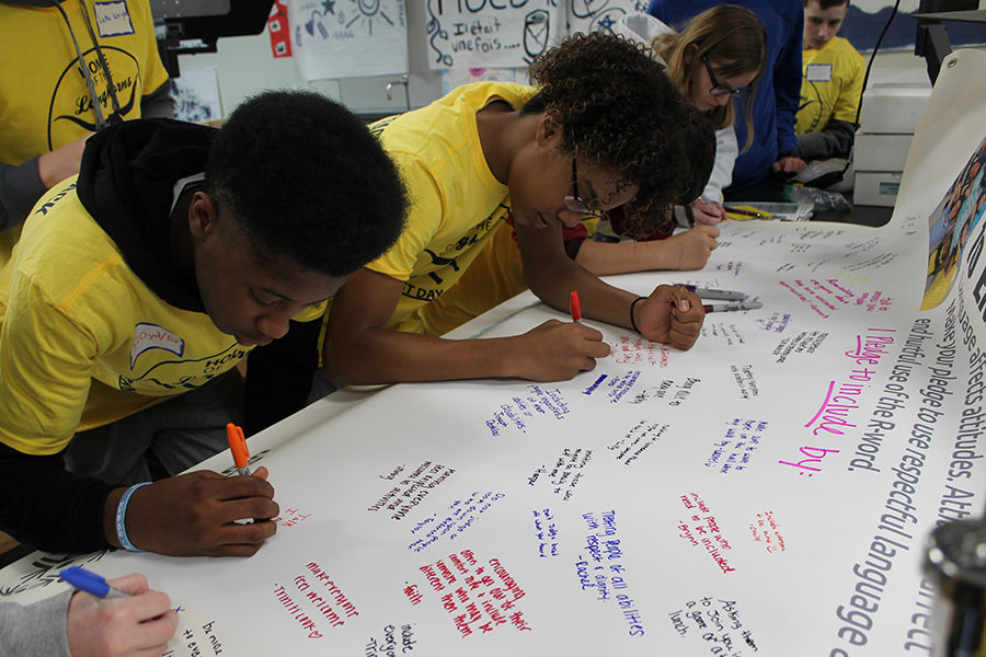 Writing messages about how to include everyone, freshmen Tre Bell and Ethan McLeod write a note about what they will do to inspire change in the community.  “I never really thought about everything that happens around me. I really have just been worried about myself, but I realized other people go through a harder time then I do. Now I am going to try help around and be a better person in the community,” Bell said