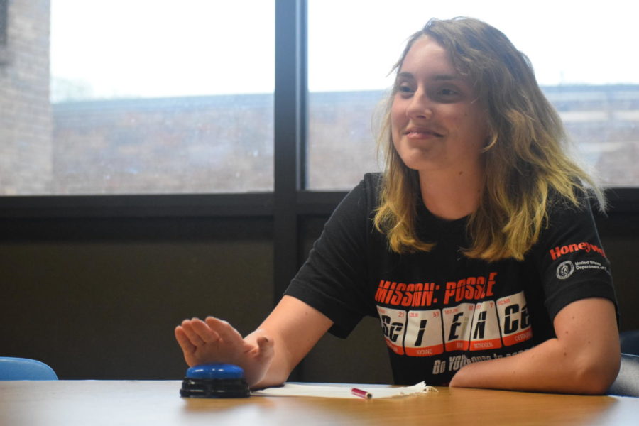 With her right hand hovering over the buzzer, senior Lindsay Perrett answers questions in the science bowl. The team answered questions that concerned all branches of math and science. “It was an exciting event for me to be a part of, and it benefitted me academically too,” Perrett said.