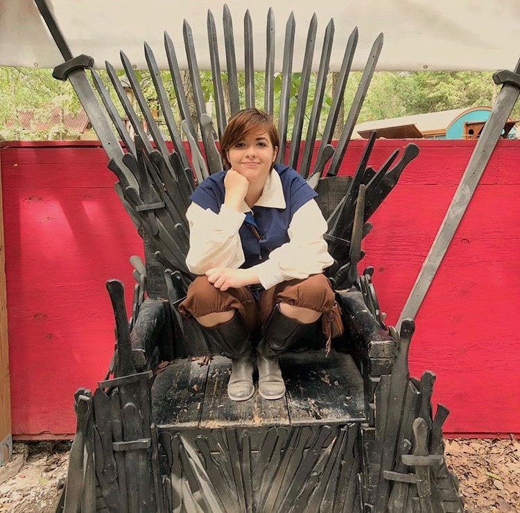 Sitting on a replica of the world-renowned Iron Throne from the series “Game of Thrones,” sophomore Vince Knight dresses in Renaissance clothes for the annual St. Louis Renaissance Festival. Knight has been cosplaying since she and her sister attended their first convention five years ago. “Everybody’s face just lights up and it’s one of the most amazing feelings in the world just to have people like and appreciate what you’re doing,” Knight said.
