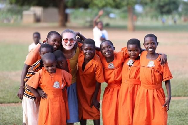 Pausing to take a photo with her new friends, sophomore Megan Gordon smiles. Gordon shadowed students during her week in Uganda. “To see how they teach was so interesting, because the kids are so well-behaved. They teach in English, so I sat in and we learned about animals and their babies,” Gordon said. The teacher gave them an activity, then left the classroom for five minutes. Everybody was sitting in their seats doing the activity like perfect children. That never would have happened in the States.”