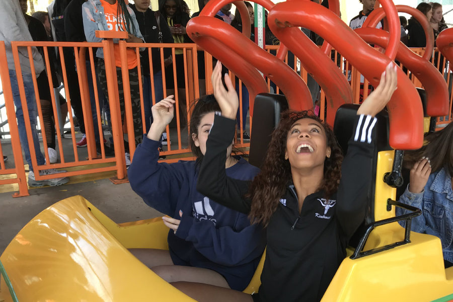 Pulling down her safety restraints, senior Madison Terry prepares to ride the Boomerang roller coaster at Six Flags St. Louis, April 2. Each year, the senior class takes a field trip to Six Flags while the underclassmen take the ACT exam. “I’m done with the ACT and almost in college now, so it was really fun to be with everyone one last time,” Terry said.