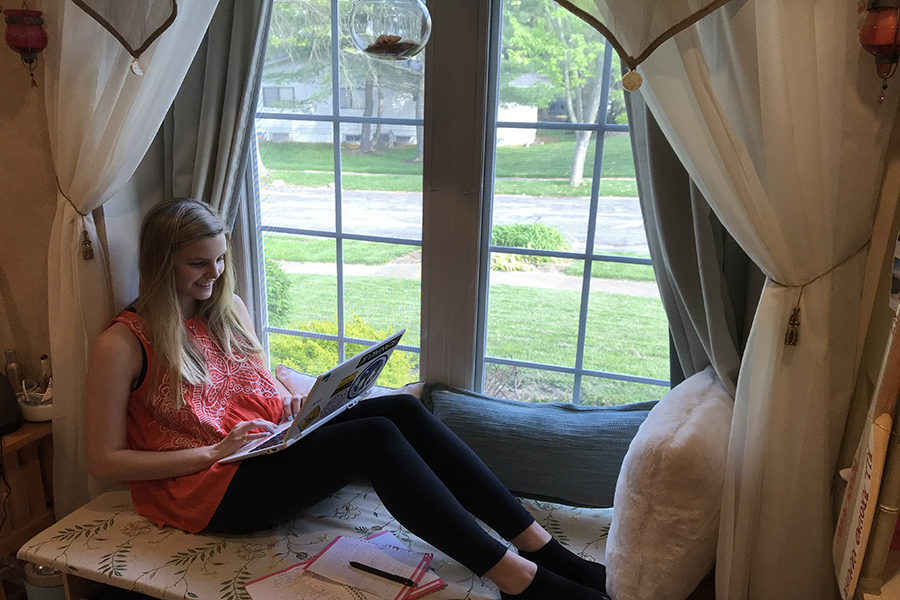 Perched in her window seat with her laptop, junior Kelsey Long works on her novel. Long has been working on revising and editing since August 2018. “I make the most progress during the summers. I usually write from 4-9 p.m. and then sporadic times throughout the day if I’m at home. During the school year, I work a couple hours in the evening a couple times a week and then some on the weekends,” Long said. 
