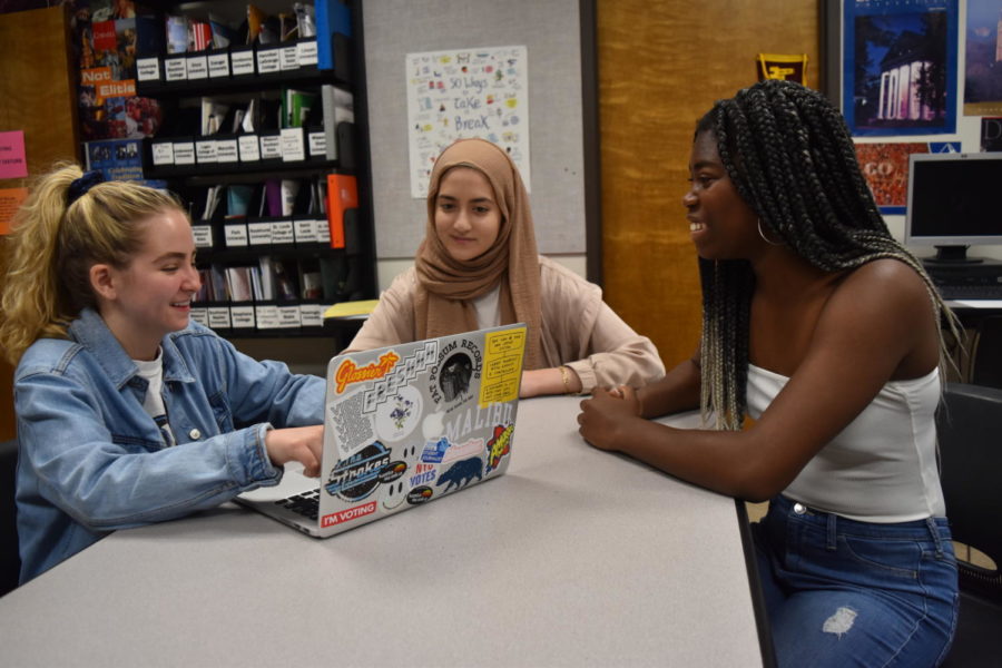 Discussing ideas for lessons, junior Sabrina Bohn, sophomore Ulaa Kuziez and junior Kaitlyn Faber plan for upcoming Common Ground meetings. The trio plan to design the Common Ground curriculum for the 2019-2020 school year. “I hope, overall, that Common Ground more effectively reaches students and allows for a more comfortable place where we can discuss the issues that the school is facing,” Bohn said.