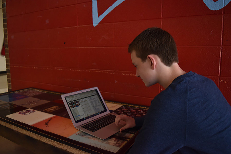 Reviewing statistics, freshman Connor Gusky prepares for the next meeting of Sports Analytics Club. Gusky used his love for math and athletics to create a club that predicts the outcome of sporting events. As a club, we come up with what we want to know and predict which team will win which game because of X, Y and Z, Gusky said. I try to make it fun and not over complicated.