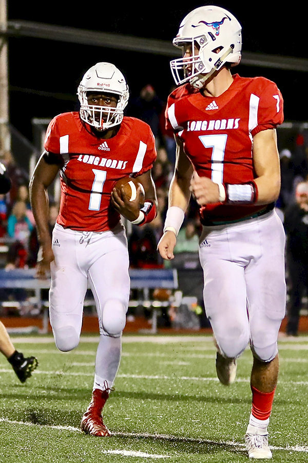 Seniors Rodney Boyd  and Jackson Barnhart move in sync to make a run during a home game.