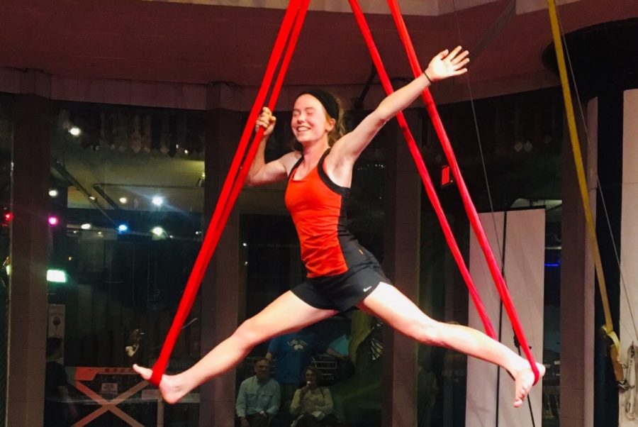 Making her way into the splits on silks, junior Callie Hummel begins to pose for the circus class. Circus Harmony at the City Museum offers classes between practices and performances. “We tried a hoop first that was hanging down from the ceiling, and then we did silks,” Hummel said. “It was something different and really fun.”