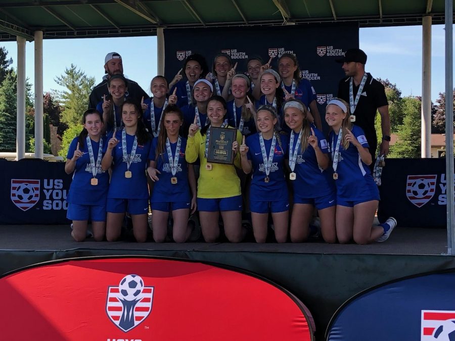 Posing with her team on the champions stage, sophomore Ella Roesch holds one finger up, indicating that her Lou Fusz Blue team won first place in the US Youth Soccer Midwest Regional Championships June 26 in Saginaw, Mich. Roesch’s team beat out teams from 15 other states, all located in the Midwest, beating Iowa Rush 3-1 in the finals. “The first goal of the game was my favorite part because I got the assist. The one who scored was one of my good friends on the team and ran right to me. We practice our celebrations, so we showed off to our parents. It was a lot of fun, but after celebrating, it was back to game time,” Roesch said.