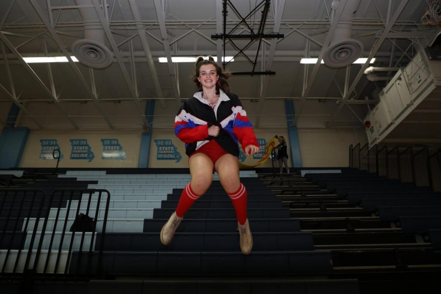 Testing the lighting and shutter speed of her new flash, senior Caroline Judd captures senior Lydia Roseman mid-air hours before the pep rally. Having taken many photos together, Roseman felt comfortable being Judd’s test subject. “[Caroline and I] do photo shoots outside of school a lot so i’m used to her taking photos of me,” Roseman said. “Homecoming week is my favorite week of the year. I always love pep rallies; they’re just super fun to get excited for and to see everyones camaraderie. It was fun being a senior this year.”