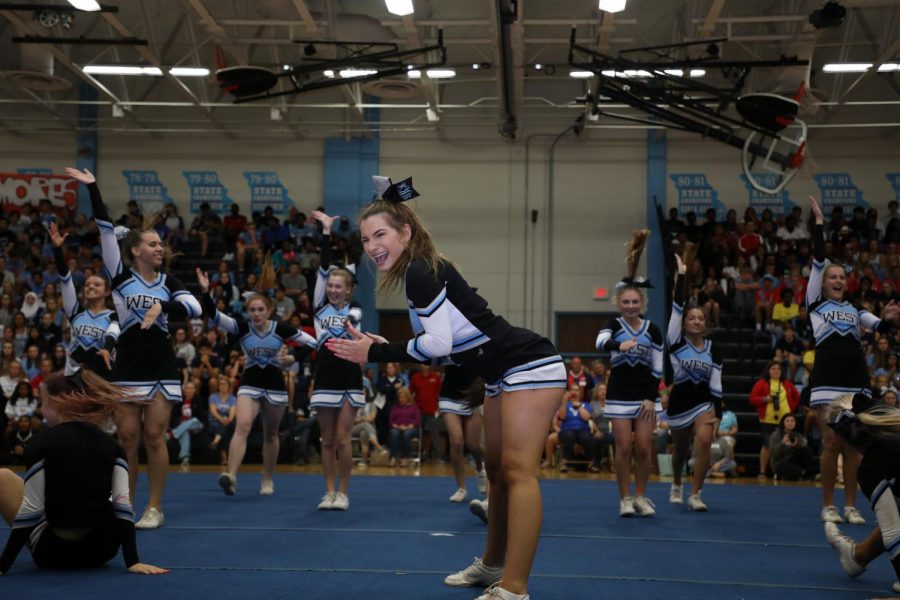 Performing a solo, senior and co-captain Grace Kroner dances with the varsity cheerleading team. The routine was choreographed in May, and the cheer team practiced three times a week for two hours to perfect it. “Performing was such an adrenaline rush and it was one of my favorite things to be on a mat performing for an audience,” Kroner said. “Knowing that my last pep rally is over, and I’ll never experience anything like that again, really pulls at my heartstrings.”