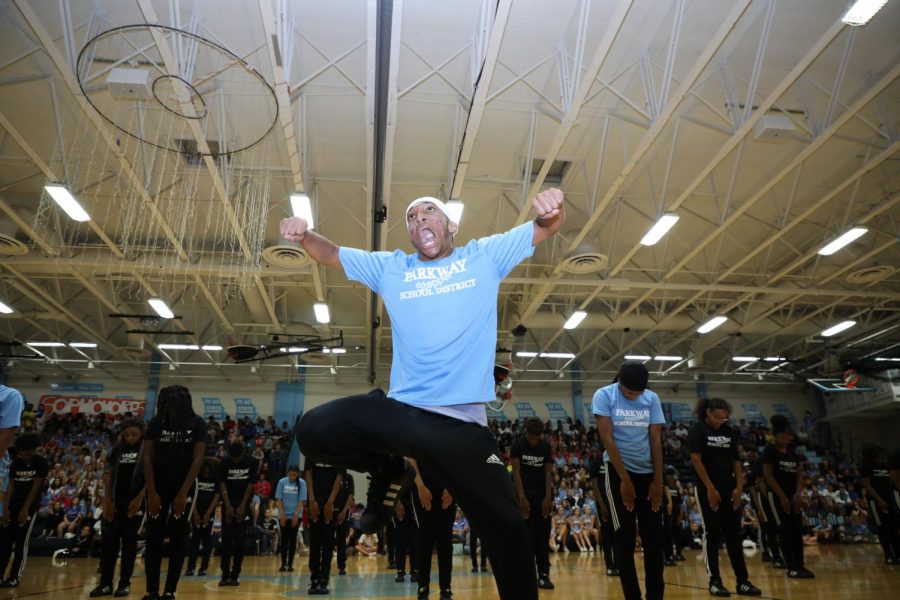 Standing front and center, senior Tywan Simms leads the district Step Team. To differentiate West students from other Parkway schools, students sported columbia blue t-shirts. “Any facial expression that you see is how I feel. In this moment, it’s all the hype and amp the crowd gave me. It’s so cool to hear all the screaming and energy,” Simms said.  