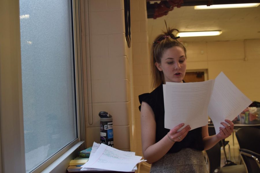Reviewing notes, junior Kathryn McAuliffe prepares for the MSHSAA speech and debate district tournament at Brentwood High School March 1.