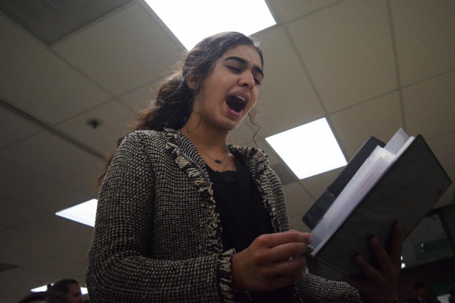 Making final adjustments during practice, junior Fatema Rehmani prepares for the Randy Pierce Winter Classic at Pattonville High School Dec. 7, 2018. Rehmani competed in Program Oral Interpretation, an event in which students incorporate various selections of literature into a 10 minute performance. “This year, I explored some different events in speech and debate, and I’m so grateful for all of the various experiences I’ve gained,” Rehmani said. “But I have noticed there are definitely expectations for certain events or debate in regards to whether it’s for guys or for girls, which is sometimes limiting and frustrating.”