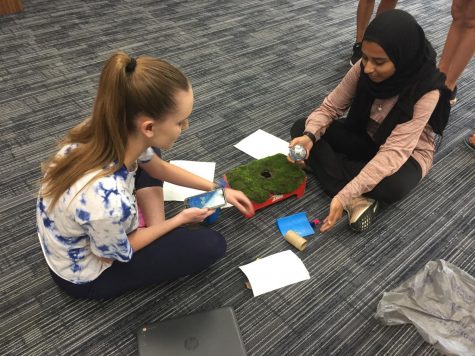 Coding a robot to better understand the perspective of characters in the class novel, sophomores Taylor Burns and Fatimah Hussain feel frustration at their robot due to their “character” limitations. This lesson taught students real-world skills such as trial and error, working together and teamwork. “There were some people getting really frustrated because they couldn’t figure it out, but they kept trying, kept experimenting and those were the sort of life skills that work their way into lessons like these,” Honors English II teacher Erin Fluchel said. 