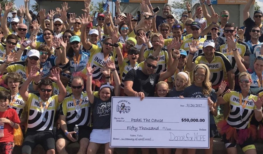 With her hands in the air, freshman Sarah Griege stands with her family and local supporters at a Pedal the Cause event in August. Her family’s organization, Powered by Hope, received a $50,000 check to support kids that are suffering from cancer. “It is such a huge milestone, and we are all so happy to receive such a great donation,” Sarah said. “This will help many kids that are suffering from cancer and give them a huge amount of support.”