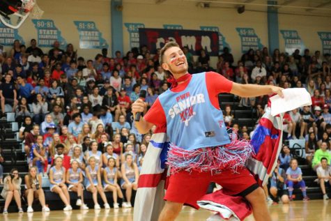 Now graduated senior Will Schuchardt cheers as he emcees the 2018 Homecoming pep rally.