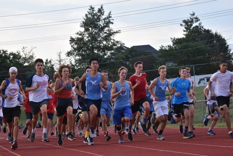 During Red and Blue night on August 27  the boys’ Cross country team came together for their first race of the season. Before racing against each other, the team captains divided the teammates into red, white and blue teams. “My teammates definitely motivate me to get better, whether it's through giving encouragement or making plans to train together,” senior Dawson Ren said.  “I'm really glad to have such awesome teammates, and I've grown really close to them. Racing with them is another joy, because we can spur each other on during competition.”