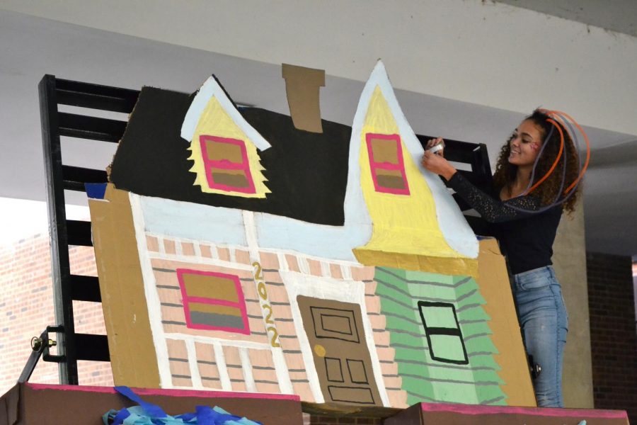 Hannah Lumpkins makes finishing touches for a house that will be on her float, corresponding with her grades “Up” theme.