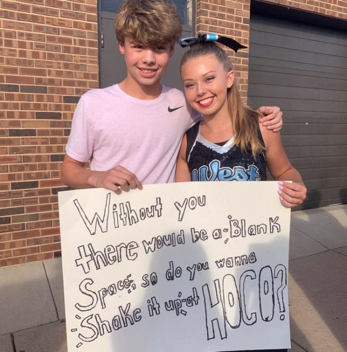 Following her performance, freshman Joey Schweppe presents his Taylor Swift themed sign to freshman Cameron Chandler. Chandler has been a long time Taylor Swift fan and was excited to see it incorporated into the sign. “I thought it was really nice for him to make a Taylor Swift sign knowing how big of a fan I am,” Chandler said. “Im really looking forward to dressing up and getting ready for the night.”
