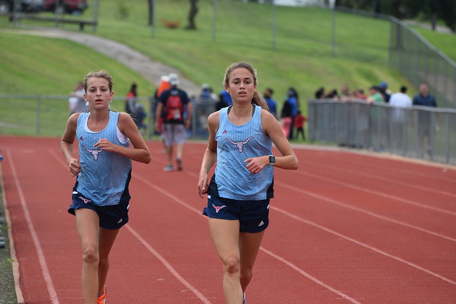 Sophomore Kate Yates and junior Emily Sipp compete in time trials Aug. 31.