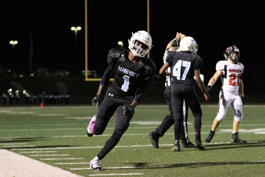 Hustling on the field, sophomore Ja’Marion Wayne breaks records at the Mayor’s Cup football game Oct. 17. Wayne broke two school records for rushing yards and all purpose yardage. “That record stood for 52 years, and he hit it as a sophomore. I think his ceiling is very high,” assistant football coach Zaven Nalbandian said. 