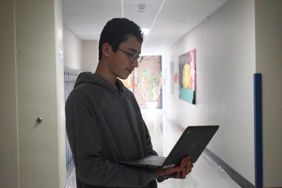 Freshman Ibrahim Kuziez works to organize materials in engineering class.