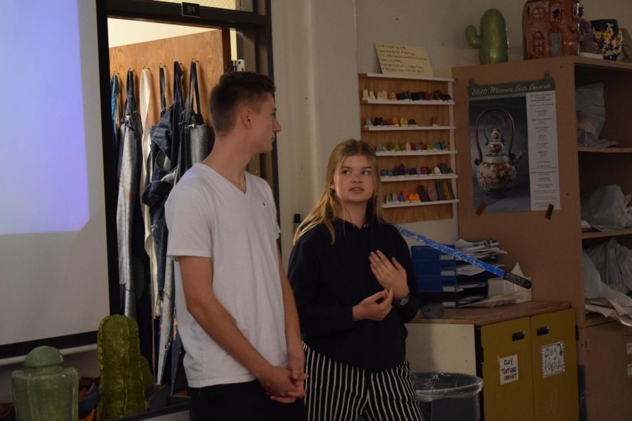 Exchange students Luke Stöckelmann and Celina Henn stand beside the projector giving a presentation. Hen and her classmates traveled to St. Louis for two weeks and departed Saturday Oct. 12. "I'm sad that I have to go back. I wish I had more time here," Henn said. "I wanted to get the experience of high school but I really like the neighborhood here."