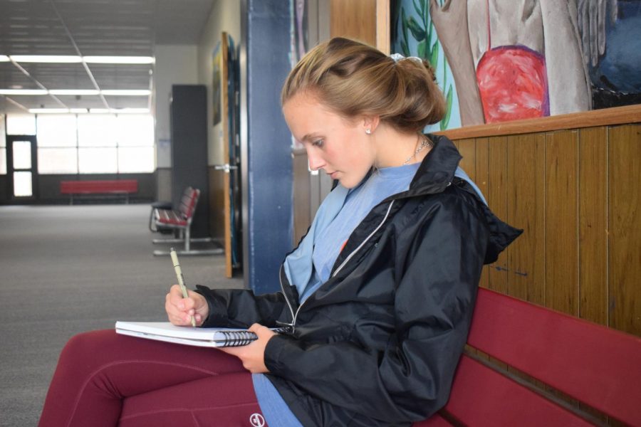 Freshman Ashlynn Gillespie reads about algebra outside of her class.