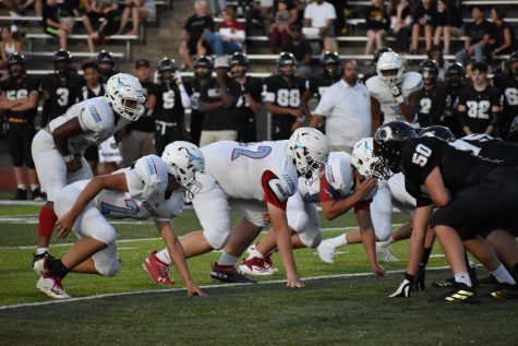 Set on the line of scrimmage, senior Chris Atkinson and his fellow Longhorns face off against Oakville Sept. 6. “Because we’re playing for the Mayor’s Cup and it’s our senior night, throughout practice we’ve been a lot more in it and focused,” Atkinson said. “We’re really confident for tonight, and on a scale of one to 10, we’re a nine. Its going to be a fun game, but it’s just sad that it’s senior night.”