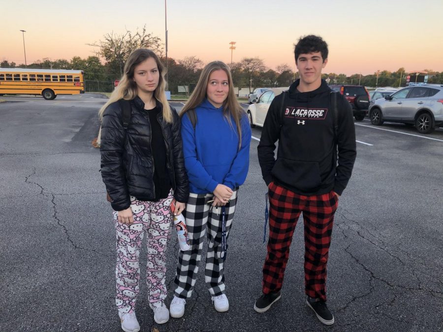 Dressed in pajamas, seniors Teya Everts, Cate McBride and Nathan Clem walk into school at 7:15 a.m.. Everts believes that a required school start time at 8:30 a.m. implemented in California would benefit students. “I think kids would get more sleep which would help academics,” Everts said. “Even if [we] got home later, we would wake up later.”