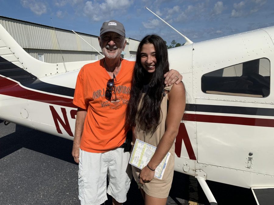 Standing in front of her family-owned plane, Nadreau and her grandpa wrap up after her first training flight. She is holding the flight checklist, which includes all the steps required to have a successful flight. “I felt very happy and proud; all the work leading up to that moment was worth it,” Nadreau said. “When I was controlling the plane, I felt nervous at first since it was my first time flying alone, but once I was in the air, I felt a lot more confident.”